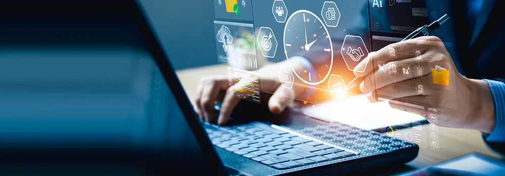 Contractor reviewing tracked labor hours and timekeeping data on a laptop